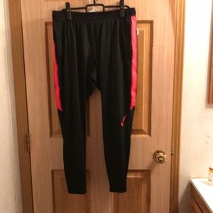 Men’s Nike Dri-Fit joggers. Black and red.